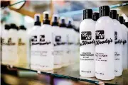  ??  ?? Woody Yaklin sells his own line of hair products at Woody’s Barber and Style Shop.