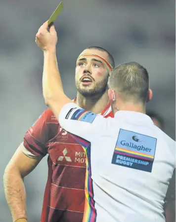  ??  ?? Gloucester skipper Lewis Ludlow is shown a yellow card by referee Ian Tempest