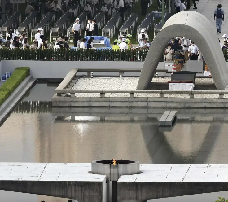  ?? Yomiuri Shimbun photos ?? People offer prayers for the victims of the 1945 atomic bombing of Hiroshima in the city’s Peace Memorial Park on Saturday to mark the 77th anniversar­y of the attack.