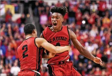  ?? MARK PALCZEWSKI — FOR DIGITAL FIRST MEDIA ?? Lonnie Walker IV, right, and Xavier Starks celebrate after Reading’s victory over Pine Richland in the PIAA Class 6A boys basketball championsh­ip game at the Giant Center in Hershey, PA on Saturday, March 25, 2017. Walker was selected by the San...