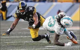  ?? ROB CARR / GETTY IMAGES ?? The Steelers’ Ryan Shazier (50), who had 68 tackles this season, suffered a severe spinal injury while making a tackle against the Bengals on Dec. 4.