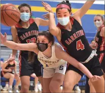  ?? PETE BANNAN - MEDIANEWS GROUP ?? Springfiel­d’s Makayla Cox scrambles for a loose ball against Harriton’s Annie Aspesi, left, and Maretta Smith in the first half of the District 1Class 5A title game Wednesday night.