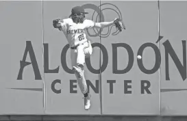  ?? RICK SCUTERI / USA TODAY SPORTS ?? Brewers rightfielder Luis Lara is unable to come up with a deep fly Wednesday in the first inning against the White Sox in Phoenix.