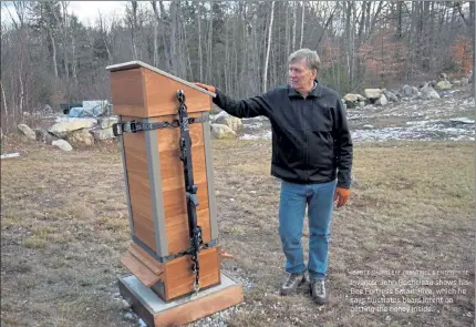  ?? SCOTT SHURTLEFF / SENTINEL & ENTERPRISE ?? Inventor John Rocheleau shows his Bee Fortress Smart Hive, which he says frustrates bears intent on getting the honey inside.