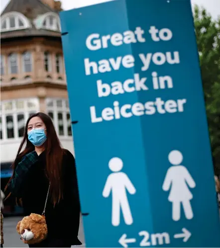  ??  ?? OPEN AND SHUT CASE:
A sign welcoming visitors back to Leicester before the lockdown there was reintroduc­ed. Restrictio­ns elsewhere in the UK have been eased using measures such as temperatur­e checks, left