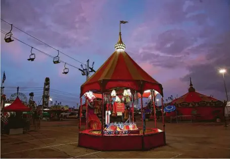  ?? Elizabeth Conley / Staff file photo ?? The carnival area was barren after the Houston Livestock Show and Rodeo was canceled after just eight days on March 11 last year.