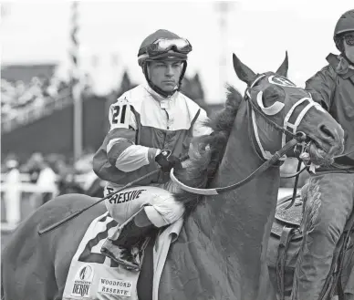  ?? MARK HUMPHREY/AP ?? Sonny Leon rides Rich Strike onto the track for the 148th running of the Kentucky Derby on Saturday at Churchill Downs in Louisville, Ky.