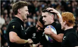  ?? David Winter/Shuttersto­ck ?? New Zealand’s Will Jordan is congratula­ted after the second of his three tries. Photograph: