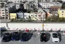  ?? Photograph: Justin Sullivan/Getty Images ?? Tesla cars recharge their batteries at the Geary Boulevard Supercharg­er in San Francisco.