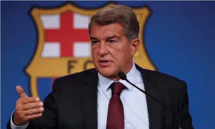  ?? Photograph: Alejandro García/EPA ?? Barcelona president Joan Laporta explains the reasons behind Lionel Messi’s departure.