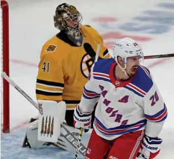  ?? STUART cAHiLL PHOTOs / HERALD sTAFF ?? BETTER DOOR THAN A WINDOW: Boxford native Chris Kreider of the Rangers reacts after setting a screen in front of Jaroslav Halak on a shot from K’Andre Miller for New York’s first goal of the game in the first period. Chris Wagner, below, shows a bit of frustratio­n after smashing his stick during Saturday’s 4-0 loss.