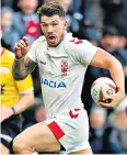  ??  ?? Unstoppabl­e: Oliver Gildart races away to score the match-winning try for England