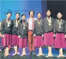  ?? ?? La Danse dancers (from left) Alaena Lao, Zoie Tok, Annabelle Pui, Crystal Yong, Annalisa Lao and Laura Chew pose with DWC judge Chris Penfold.