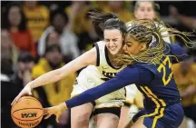  ?? AP ?? Caitlin
Clark (left), the NCAA Division I alltime scoring leader, will go first to the Indiana Fever on Monday night when the WNBA draft takes place at the Brooklyn Academy of Music in front of 1,000 fans.