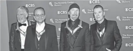  ?? FILE/GREG ALLEN/INVISION/AP ?? From left, Adam Clayton, Bono, The Edge and Larry Mullen Jr., of the Irish band U2, received the Kennedy Center Honors last year. The band’s latest release, “Songs Of Surrender,” is a collection of 40 re-recorded and reimagined songs from across the band’s catalog.