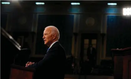  ?? ?? Joe Biden addresses a joint session of Congress on 28 April 2021. Photograph: Getty Images