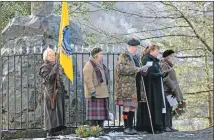  ??  ?? Ann McGhee, Lois MacDonell, John MacFarlane, Rev Amanda Fairclough and Roz MacDonald at the memorial.