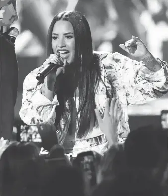  ?? JOHN SALANGSANG/THE ASSOCIATED PRESS ?? Demi Lovato’s hospitaliz­ation prompted celebritie­s such as Missy Elliott, Ariana Grande and Brad Paisley to tweet their support. The hashtag #PrayForDem­i also trended on Twitter.
