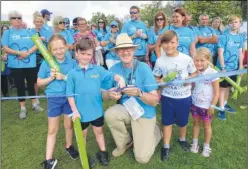  ?? FM4906856 ?? Keith Oliver and his young helpers who cut the ribbon to start the Memory Walk