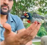  ??  ?? Dhoni with the bird