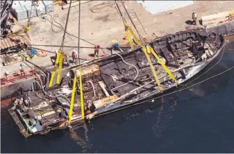  ?? Brian van der Brug / Los Angeles Times 2019 ?? The burned hull of the dive boat Conception is secured by a salvage team off Santa Cruz Island.