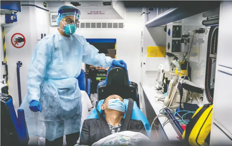  ?? ANTHONY KWAN / GETY IMAGES ?? A patient is transferre­d by ambulance to the Infectious Disease Centre of Princess Margaret Hospital in Hong Kong, a city which has reported two cases of Wuhan coronaviru­s.