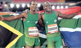  ?? PICTURE: EPA ?? FLASHBACK: South African sprinters Akani Simbine (right), who won gold, and Henricho Bruintjies, who took silver, celebrate after finishing first and second in the 100m final at the Gold Coast Commonweal­th Games last month.