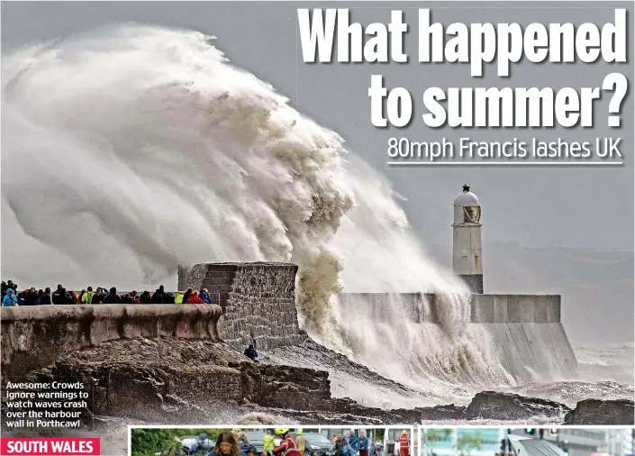  ??  ?? Awesome: Crowds ignore warnings to watch waves crash over the harbour wall in Porthcawl