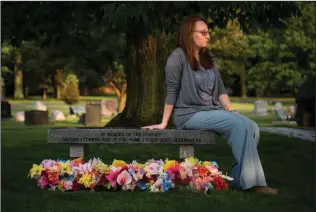  ?? Carolyn Van Houten/Washington Post ?? Kate Plants lost five stored embryos when a freezer tank malfunctio­ned at a fertility center. The memorial, at a cemetery in Middleburg Heights, Ohio, honors the “unborn” lost in the accident.