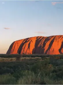  ??  ?? 03 01 Uluru at sunrise is a spectacula­r view to wake up to 02 Walking around the base of Uluru is a meaningful experience 03 The Rock glows red in the sun 04 The Dune Pavilion at Longitude 131°05 Dune Top dining. All images © Longitude 131°