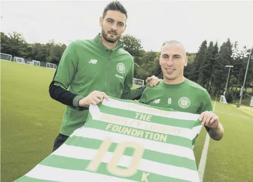  ??  ?? Craig Gordon and Scott Brown mark the announceme­nt of Celtic FC Foundation’s £10,000 donation to the Bradley Lowery Foundation.