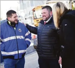  ?? Tyler Sizemore / Hearst Connecticu­t Media ?? Traffic Signal Supervisor Stephen Frycz, left, and Transporta­tion Bureau Chief Frank Petise, center, chat with Stamford Mayor Caroline Simmons on March 22.