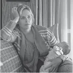  ??  ?? Theron, 42, put on nearly 50 pounds to portray struggling Marlo’s post-pregnancy body.