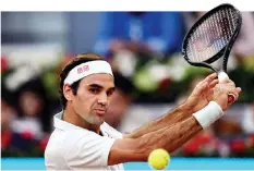  ?? — AFP photo ?? Federer returns the ball to Richard Gasquet during their ATP Madrid Open round of 64 tennis match at the Caja Magica in Madrid.