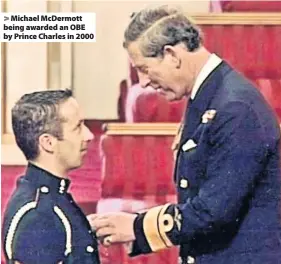  ??  ?? Michael McDermott being awarded an OBE by Prince Charles in 2000