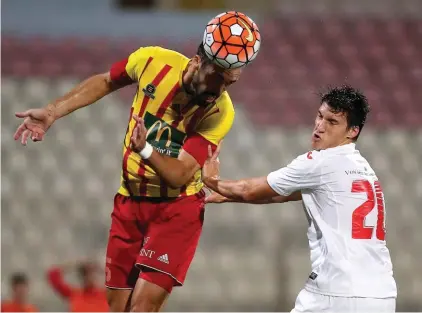  ??  ?? Nikola Vukanac of Birkirkara (left) clears his lines ahead of Federico Falcone of Valletta (right) Photo: Domenic Aquilina