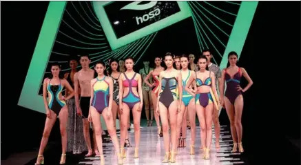  ?? YU REN / FOR CHINA DAILY ?? Models flaunt the latest designs in swimwear of Hosa Group, which generated 46.5 percent of 1.17 billion yuan in revenue in 2015.