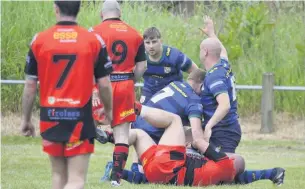  ??  ?? Gareth Sharrocks and Adam Browne keeping the opposition out