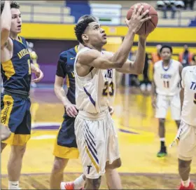  ?? Eric Jenks / Special to the Times Union ?? Troy’s Latyce Faison, who led the Flying Horses with 20 points, maneuvers with the ball against Averill Park during Tuesday night’s game.