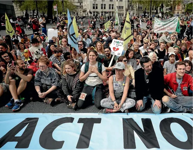  ?? AP ?? Extinction Rebellion protesters block Parliament Square in central London on Tuesday. Organisers have now called off the protest, having largely achieved their immediate aims. The question remains as to whether the movement will make any progress in terms of policy decisions.