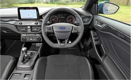  ??  ?? Cabin is largely identical to standard Focus. Touchscree­n position means trio of dashtop dials found in past STs are no more