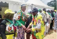  ?? ?? ZANU-PF political commissar Dr Mike Bimha greets party cadres on arrival for a star rally at Mkoba Stadium in Gweru yesterday