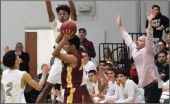  ?? MIKE BUSH/NEWS-SENTINEL ?? Liberty Ranch High boys basketball coach Josh Williams (right) calls out instructio­ns during a Division IV boys basketball quarterfin­al game on Feb. 23.