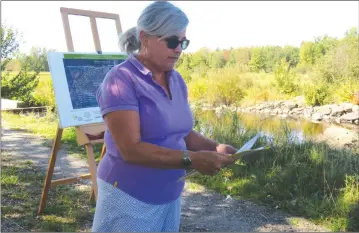  ?? ANN DAVIDSON ?? The recently elected president of Renaissanc­e Lac-brome, Hélène Drouin, welcomed stakeholde­rs who supported and collaborat­ed in a three-year stream restoratio­n project to the ribbon-cutting ceremony held on the newly constructe­d eco-friendly bridge...