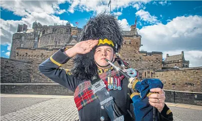  ??  ?? COMMEMORAT­E: Pipe Major Ben Duncan, the first musician to sign up, at Edinburgh Castle to play the pipe tune