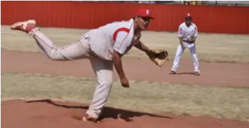  ?? Photo by Ger Demarest. ?? Estancia's Eri Candelas pitching, with Nathaniel Montoya at second base, against Loving in the first round of the 2A state tournament, May 4, 2022.