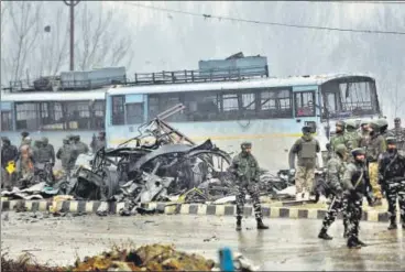  ?? WASEEM ANDRABI/ HT PHOTO ?? ▪ At least 44 CRPF personnel are feared dead after a Jaish suicide bomber rammed a vehicle carrying over 100 kg of explosives into their bus in Pulwama district on Thursday.