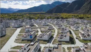  ?? XINHUA PUBU TASHI / ?? Sanyou village in Quxu county is one of 376 poverty alleviatio­n settlement­s developed last year in Tibet.