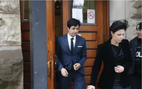  ?? RENÉ JOHNSTON/TORONTO STAR ?? Jian Ghomeshi and lawyer Marie Henein leave court Thursday after Ghomeshi was cleared of sexual assault and choking charges.