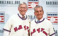  ?? ASSOCIATED PRESS ?? Former commission­er and Milwaukee Brewers owner Bud Selig (left) and Atlanta Braves President John Schuerholz pose with their Hall of Fame jerseys on Monday.